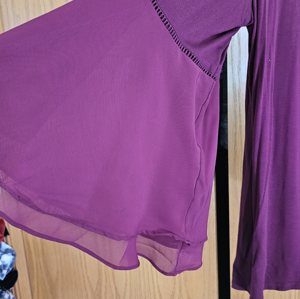Plus size burgundy blouse.